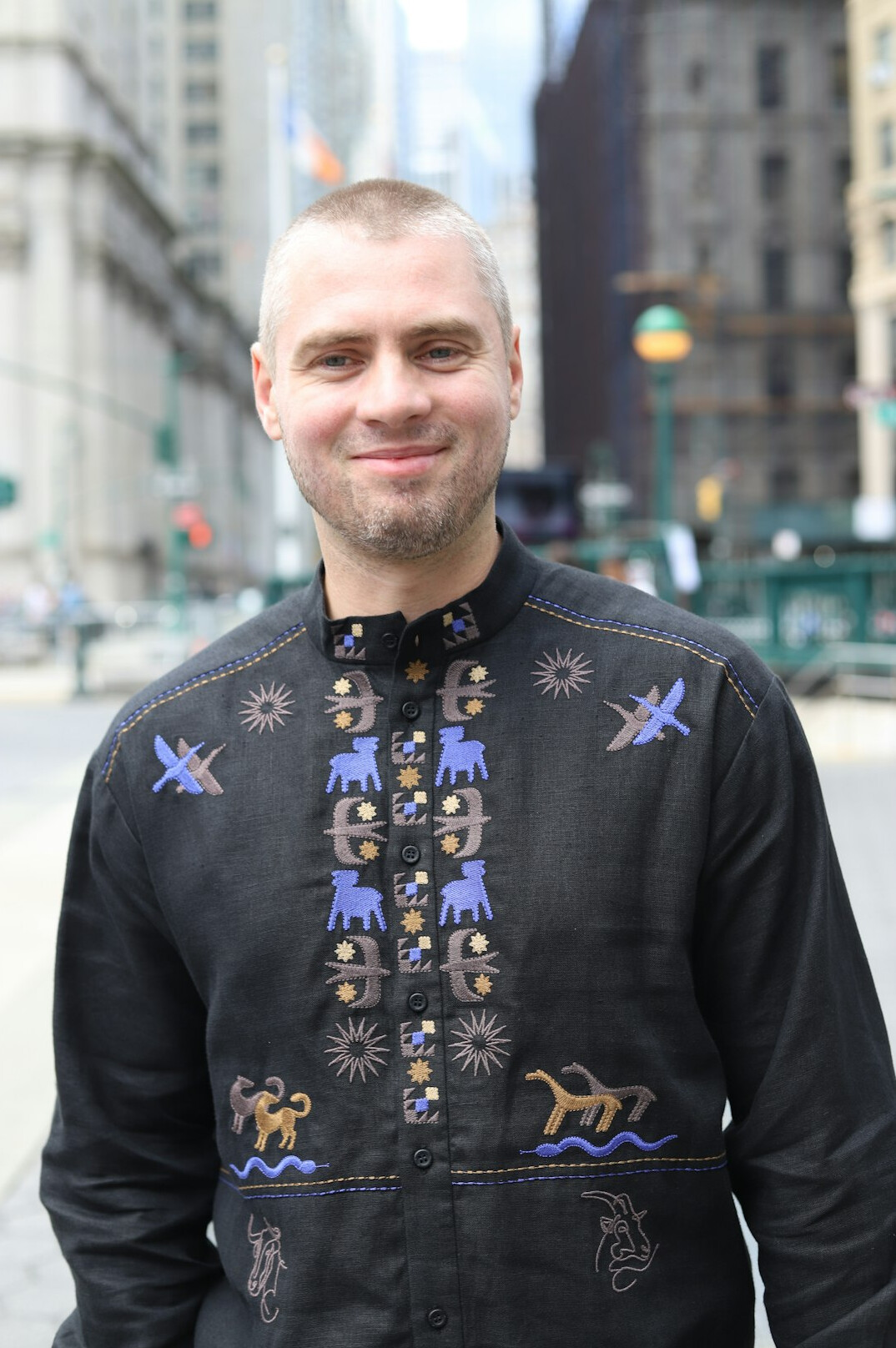 Smiling Indigenous Canadian man in business casual attire
