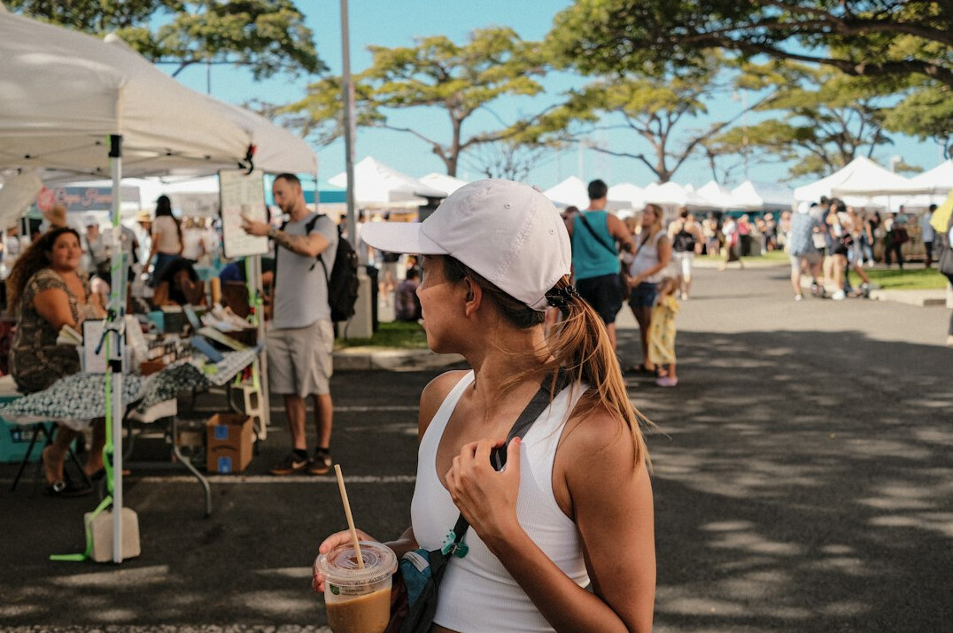 Lively weekend farmers market with vendors and shoppers